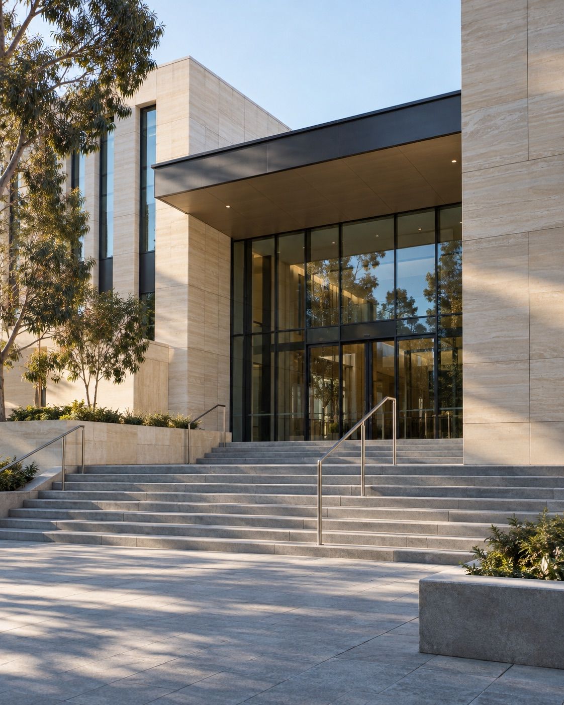 Contemporary civic building entrance with sandstone and glass